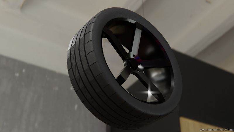 A black car rim and a tire